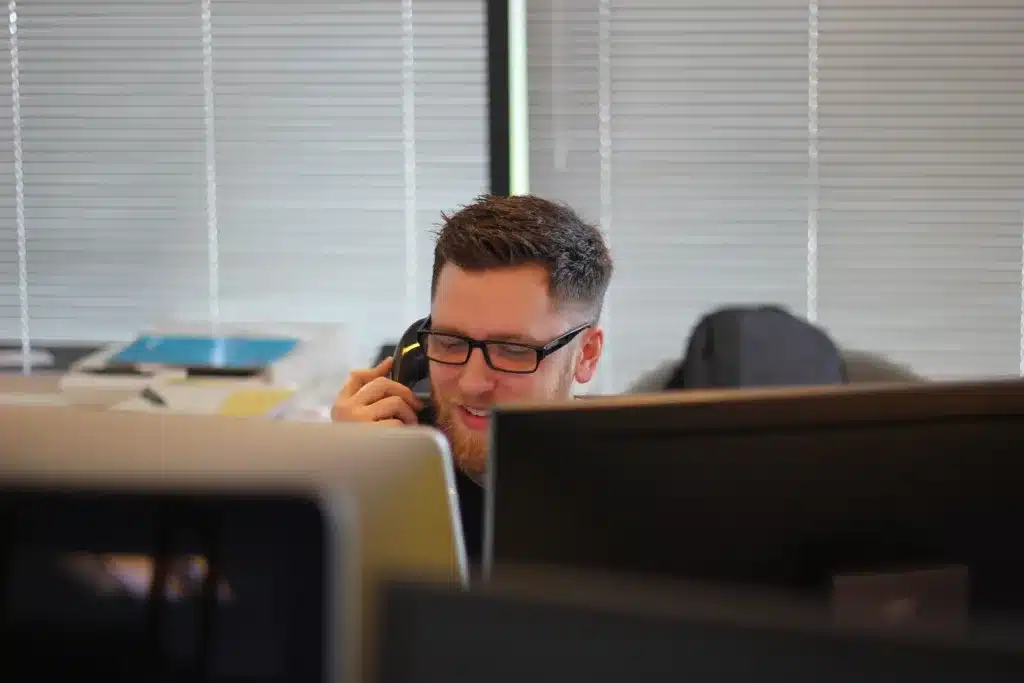 man using IP phone inside room. Are you having a difficult day? prioritize self-care in difficult days and keep calm.