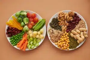 Plate of Assorted Vegetables Beside a Plate of Nuts and Beans. Balanced diet, mental clarity